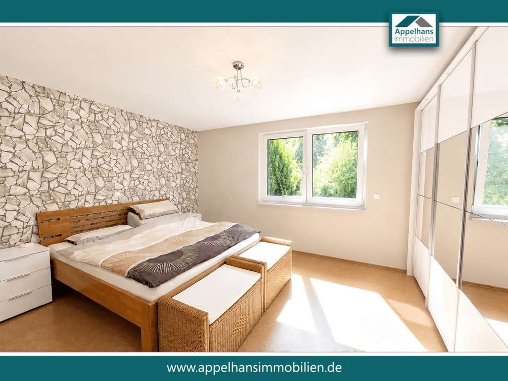 Immobilie in Bippen - Modernisiertes Zweifamilienhaus mit zwei Wohneinheiten, Wintergarten, Kamin und großzügigem Garten - Bild 1