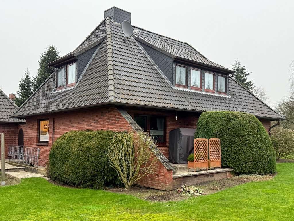 Immobilie in Oldersbek - Tlw. unterkellertes Einfamilienhaus mit Anbau, Sauna, Garage und Terrasse nahe der Kreisstadt Husum - Bild 1