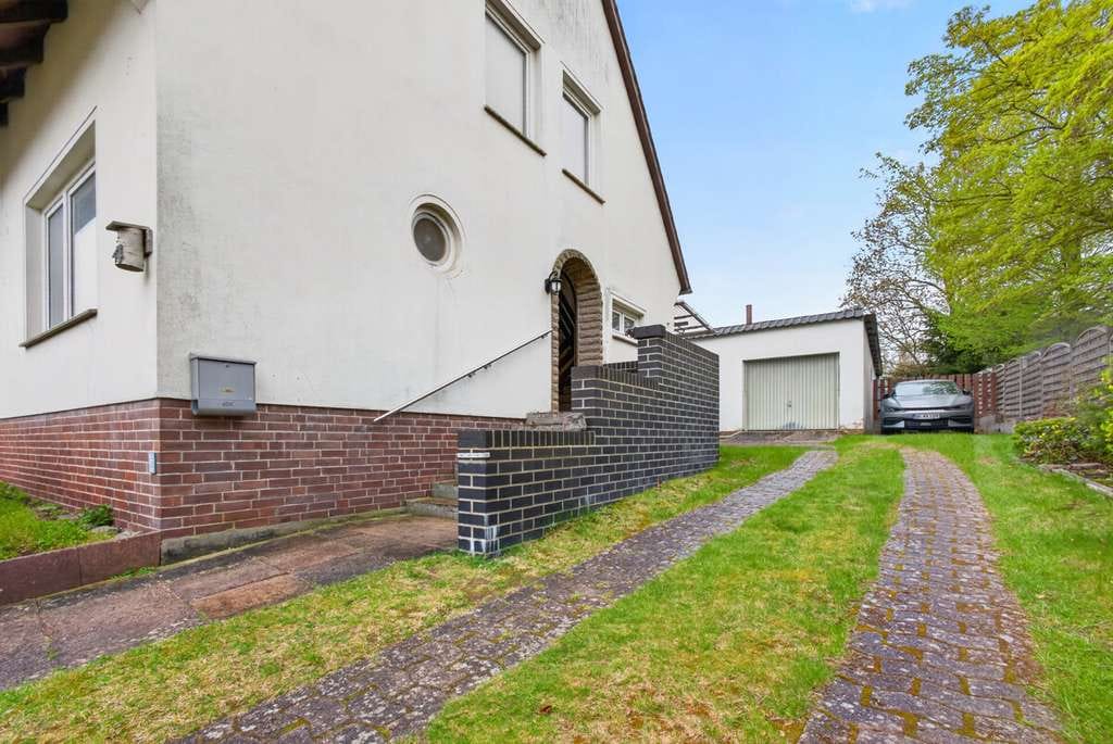 Immobilie in Bruchhausen-Vilsen - Bruchhausen-Vilsen | Vielseitiges Einfamilienhaus in zentraler Lage mit Garten und Garage - Bild 2