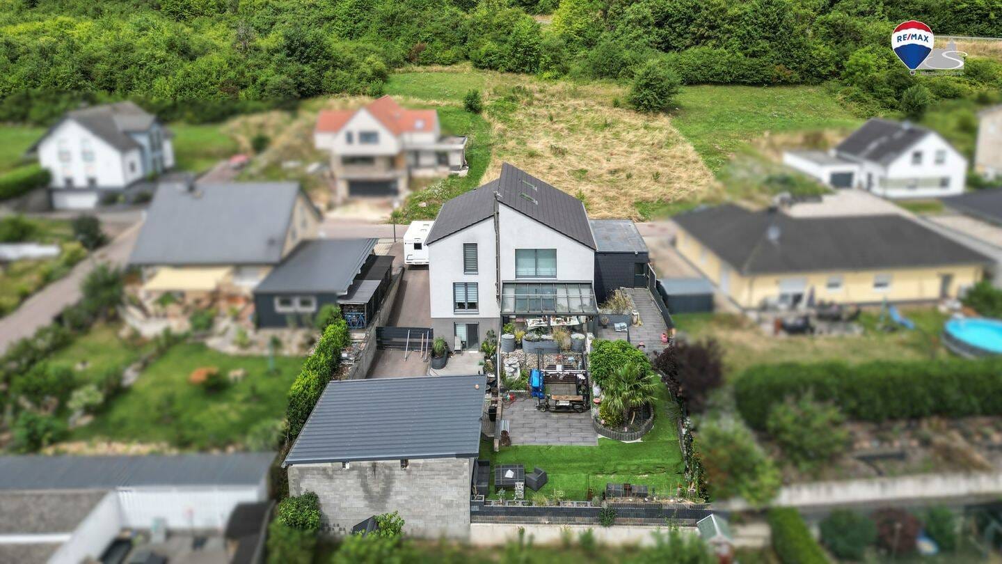Immobilie in Kirf - Einziehen & wohlfühlen - modernes Zweifamilienhaus mit ELW & Wintergarten - Bild 3