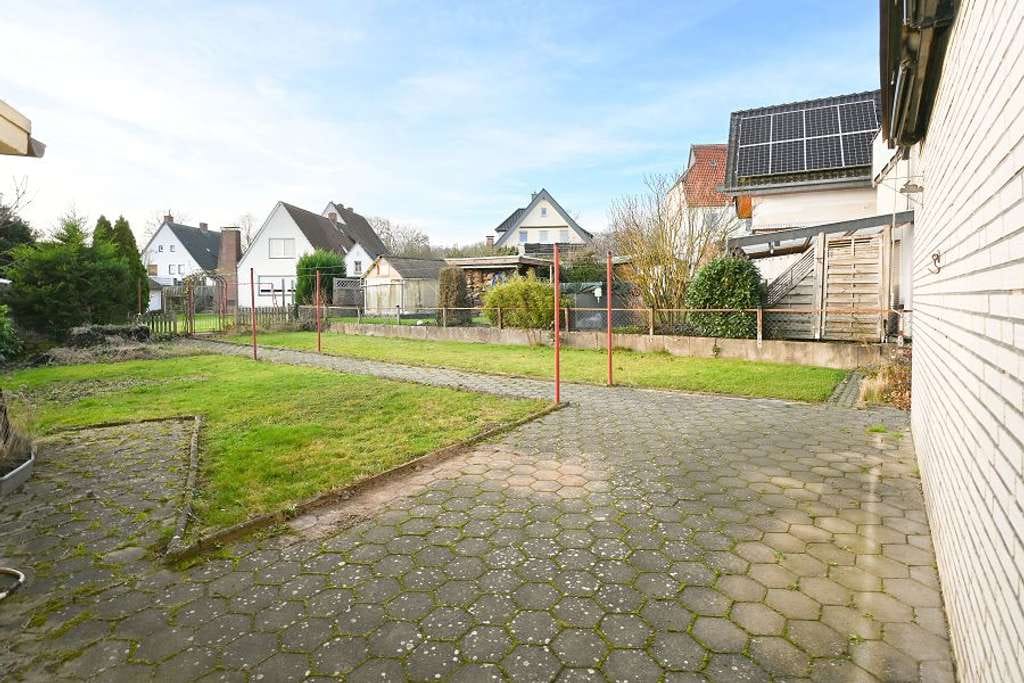 Immobilie in Melle - Attraktives Ein- bis Zweifamilienhaus auf schönem und erweiterbarem Grundstück in Melle! - Bild 1