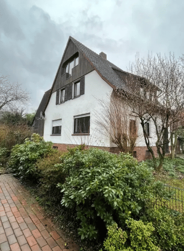 Immobilie in Hasbergen - Charmantes Einfamilienhaus mit Wintergarten, viel Platz & großem Potenzial in zentraler Lage von Hasbergen - Bild 1