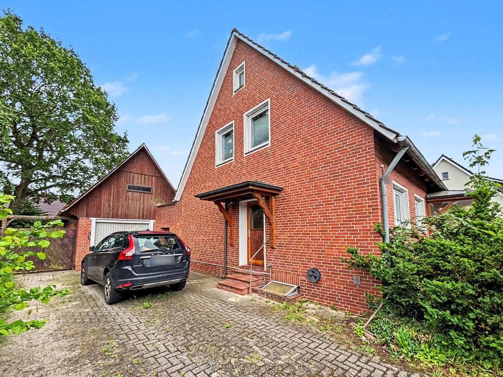 Immobilie in Großenkneten - Charmantes Einfamilienhaus mit Wintergarten in ruhiger Sackgassenlage zentral in Ahlhorn - Bild 1