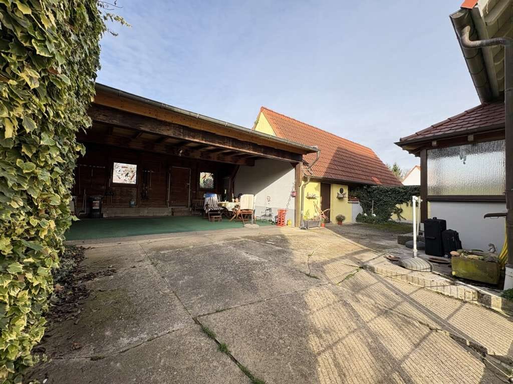 Immobilie in Walzbachtal - Doppelhaushälfte mit Potenzial in ruhiger Lage mit Garten & großem Carport - Bild 1