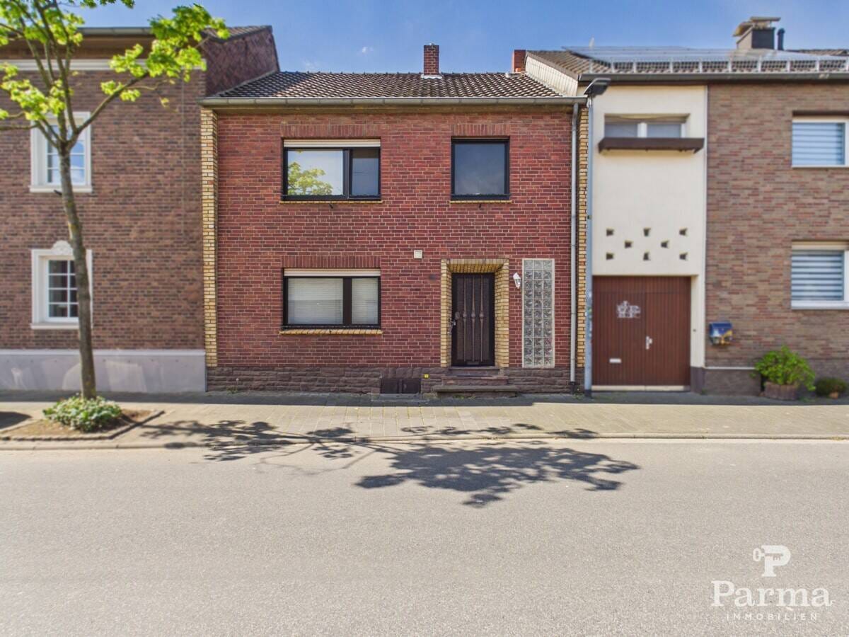 Immobilie in Niederzier - Gepflegtes Reihenmittehaus mit großem Garten in familienfreundlicher Lage von Huchem-Stammeln - Bild 0