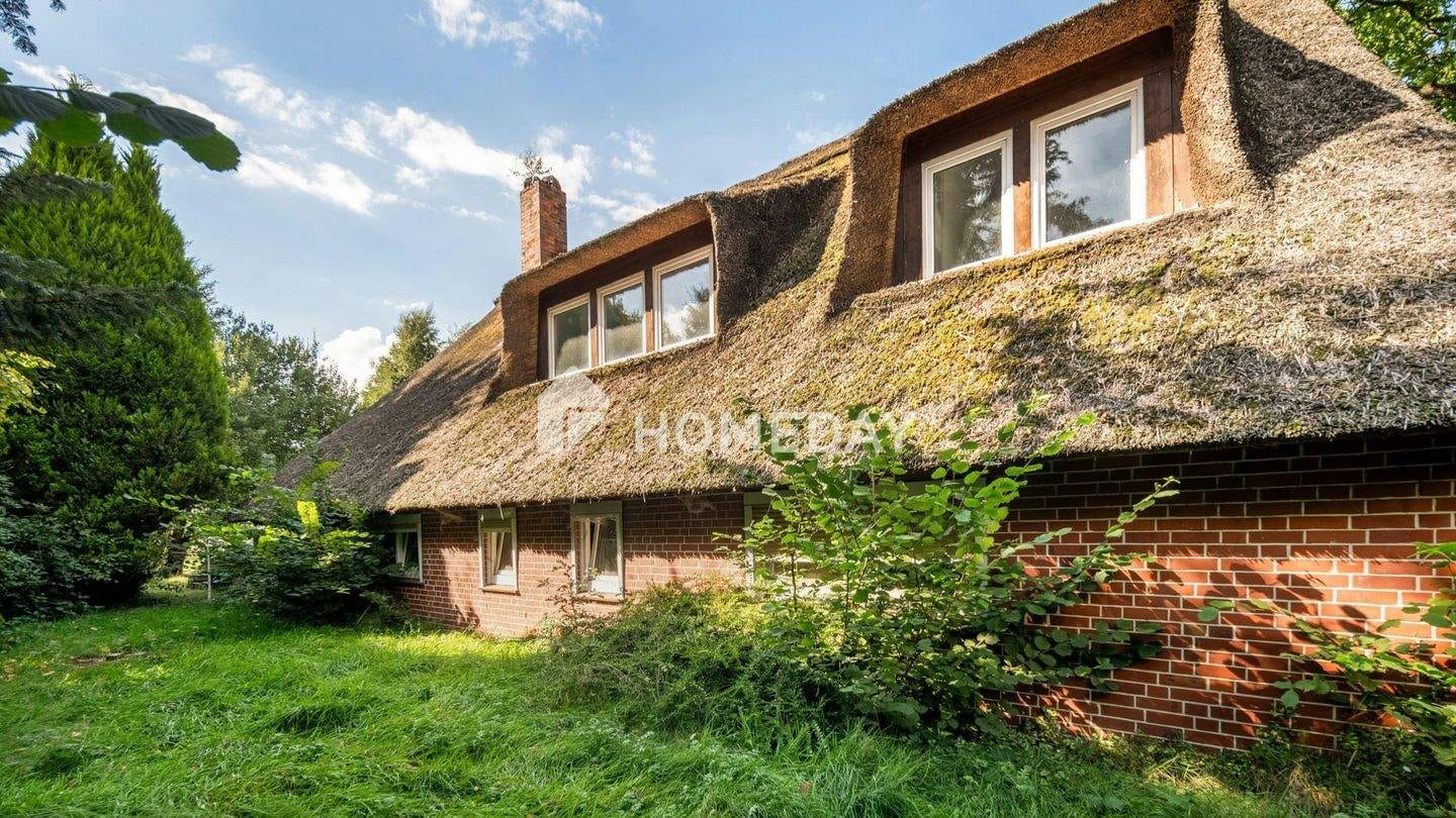 Immobilie in Vollersode - Charakterhaus unter Reet mit großem Garten - Bild 2