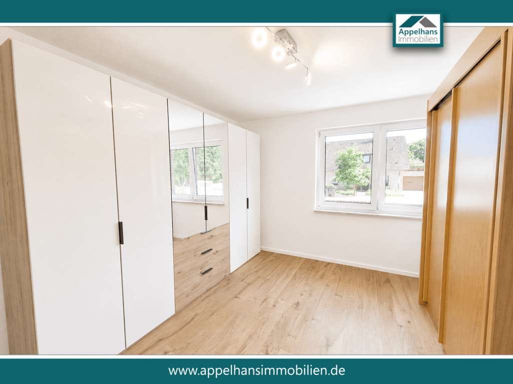 Immobilie in Bippen - Modernisiertes Zweifamilienhaus mit zwei Wohneinheiten, Wintergarten, Kamin und großzügigem Garten - Bild 2
