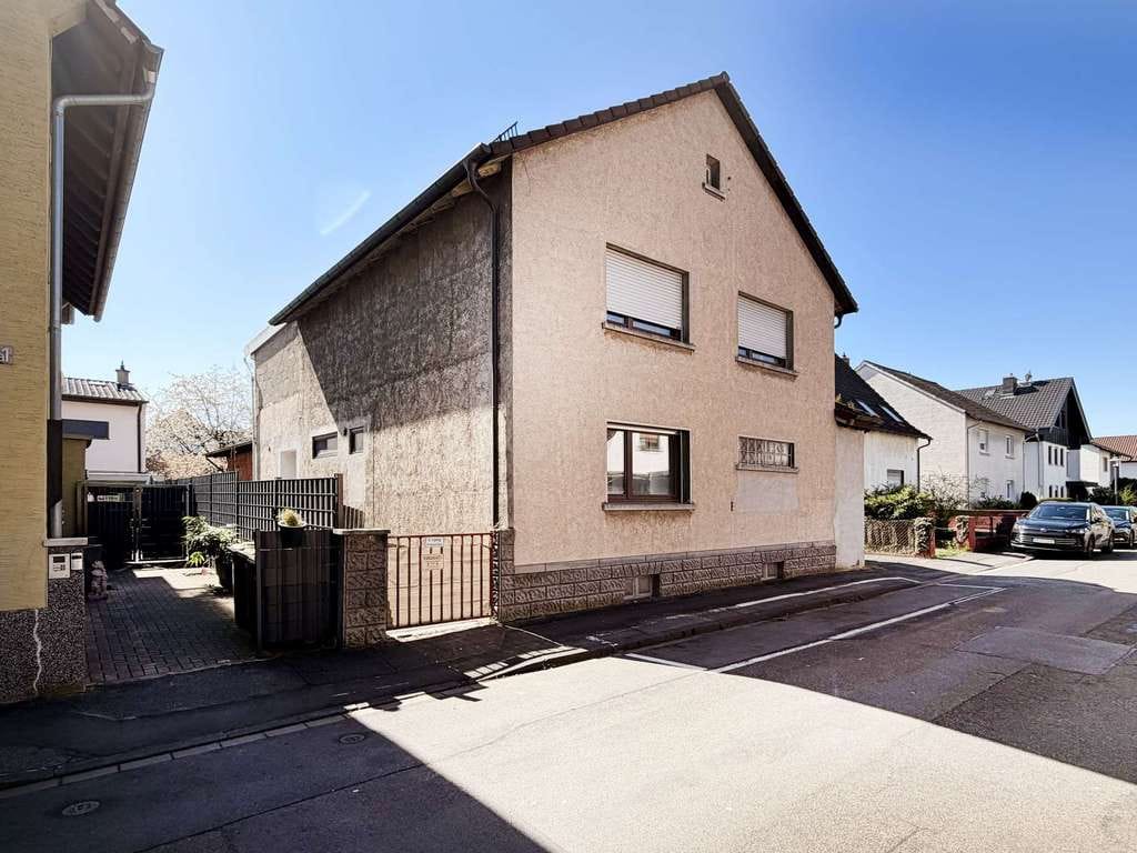 Immobilie in Bürstadt - Attraktive Erdgeschosswohnung mit Terrasse, Garten und viel Potenzial in ruhiger Lage von Bürstadt - Bild 2