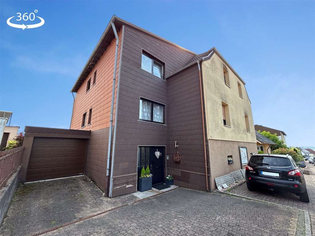 Immobilie in Riegelsberg - Zweifamilienhaus mit großem Garten und Garage - Bild 0