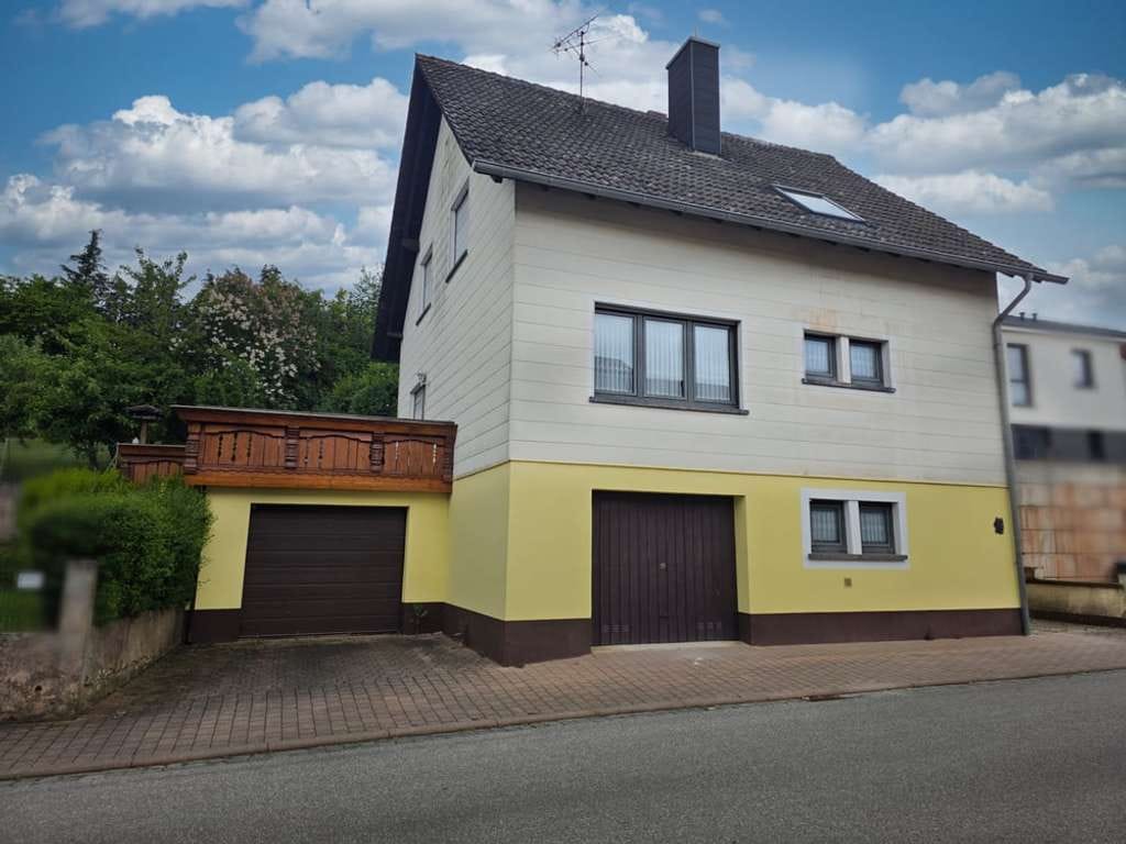 Immobilie in Dunzweiler - 1‑Familienhaus mit Ausbaupotenzial: Garten, Südterrasse, 2 Garagen & optionale 2. Wohneinheit - Bild 2