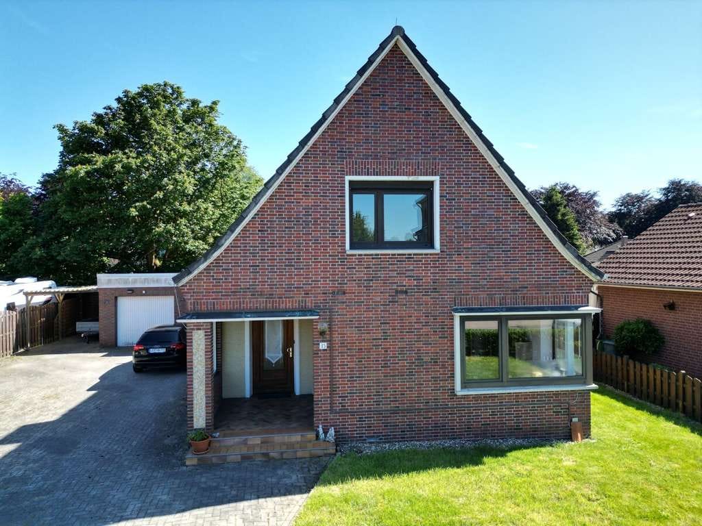 Immobilie in Moormerland - Einfamilienhaus mit Einliegerwohnung in
guter - zentraler Wohnlage - Bild 1