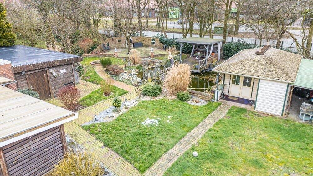 Immobilie in Niederlangen - Vermietetes Einfamilienhaus mit Garage, Carport, überdachter Terrasse und großem Gartenhaus! - Bild 4
