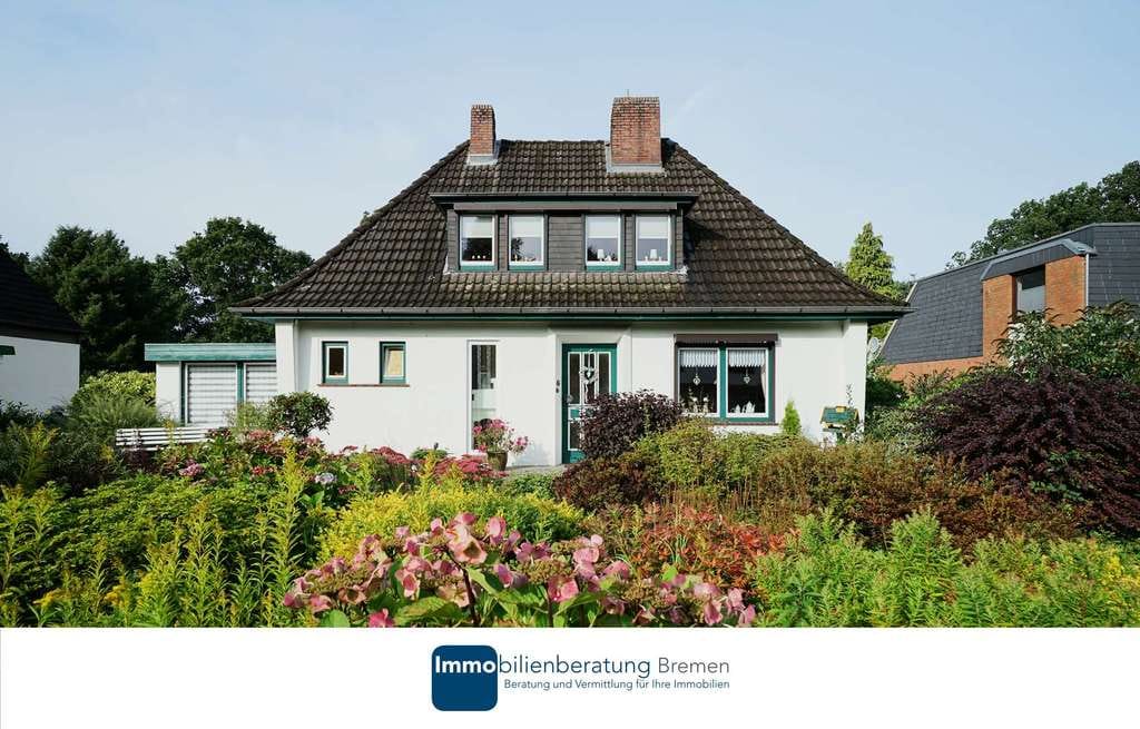 Immobilie in Ritterhude - Charmantes Einfamilienhaus auf attraktiven Hanggrundstück mit Carport - Bild 0