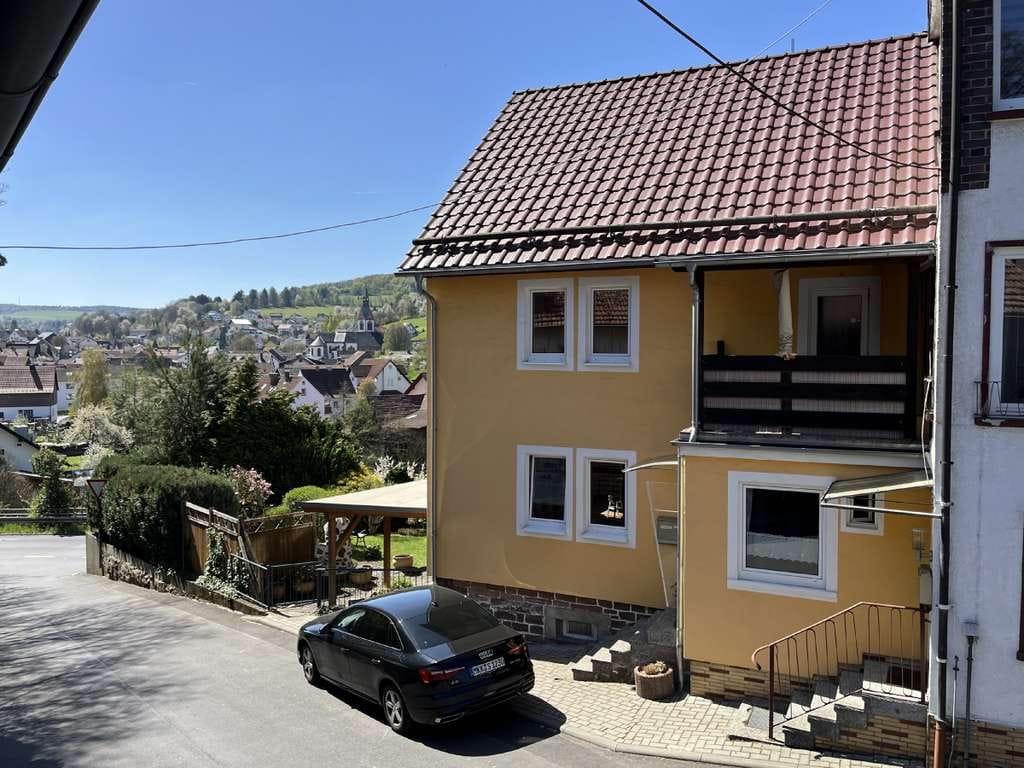 Immobilie in Jossgrund - AS-Immobilien.com+Gemütliches Einfamilienhaus mit Garten, Kaminofen & schöner Aussicht in Jossgrund - Bild 0