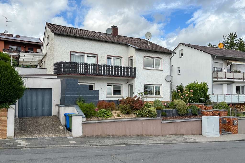 Immobilie in Reinheim - Sofort bezugsfrei – Attraktives Zweifamilienhaus für Familie und Generationen in Reinheim - Bild 1