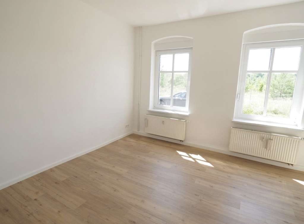 Immobilie in Schipkau - Vollvermietetes Doppelhaus im Denkmalensemble | 190 m² Wohnfläche | 21.000 € Jahresnettokaltmiete - Bild 1