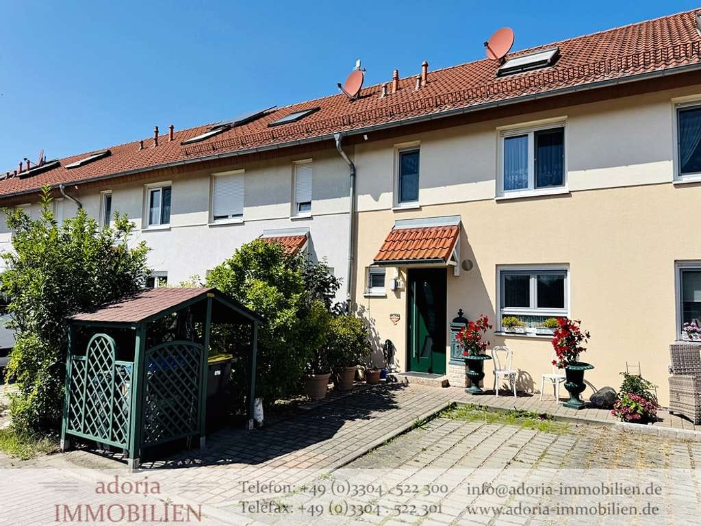 Immobilie in Oberkrämer - Sehr gepflegtes Reihenmittelhaus mit Wintergarten und Ausblick aufs Feld in beliebter Wohnsiedlung - Bild 0