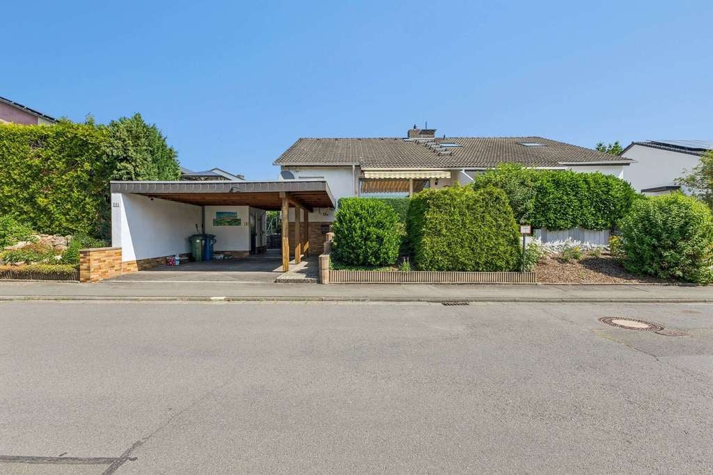 Immobilie in Pohlheim - Gepflegte Doppelhaushälfte in ruhiger Feldrandlage mit Pool und Garten - Bild 1