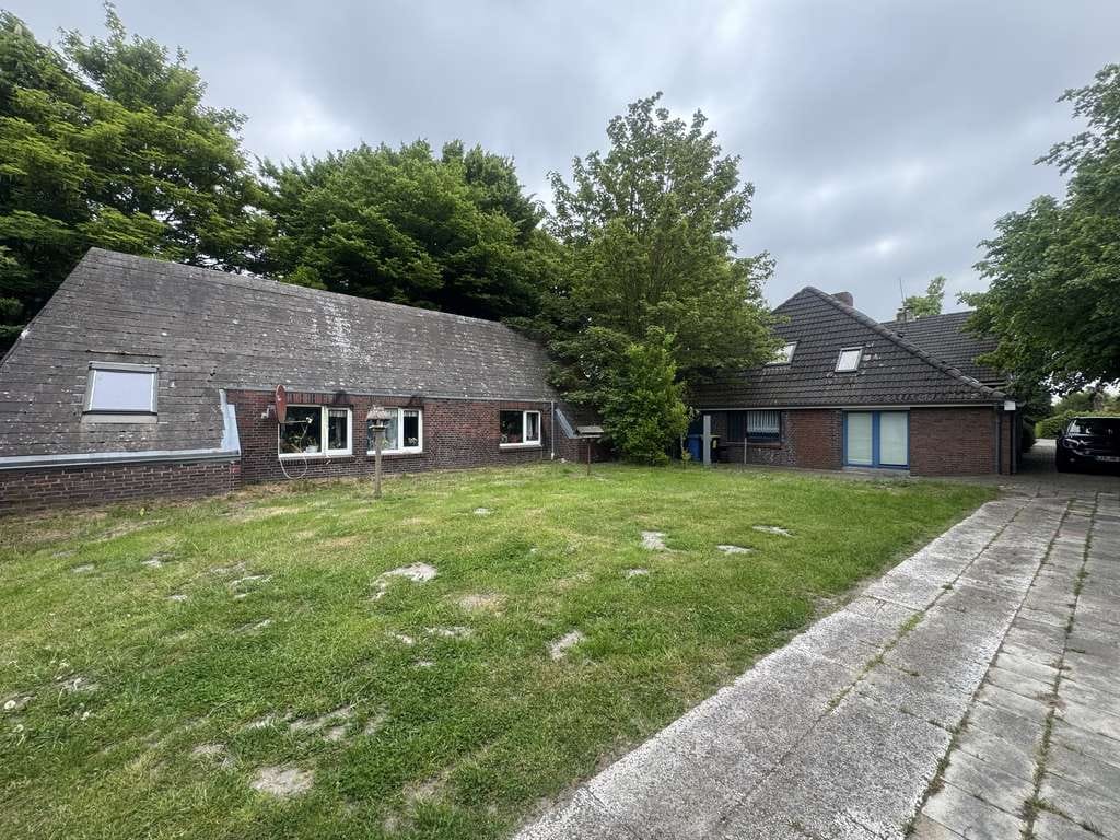 Immobilie in Südbrookmerland - Attraktives Anlageobjekt: Mehrfamilienhaus mit Optimierungspotenzial - Bild 1