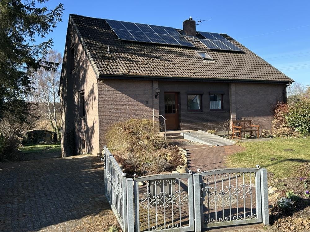 Immobilie in Bassum - Ortsrandlage Bassums! Einfamilienhaus mit unverbautem Blick direkt am Klosterbach gelegen! - Bild 1