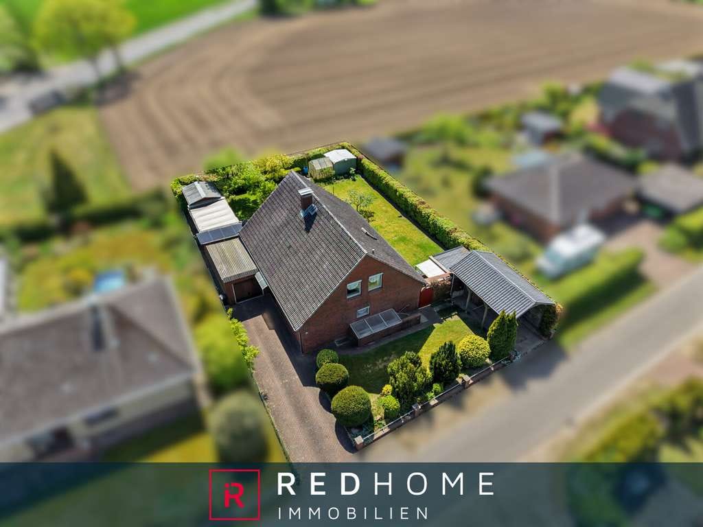 Immobilie in Hennstedt - Feldrandlage! Einfamilienhaus ca. 170 m² Wohn- und Nutzfläche sowie Vollkeller in ruhiger Lage von H - Bild 0
