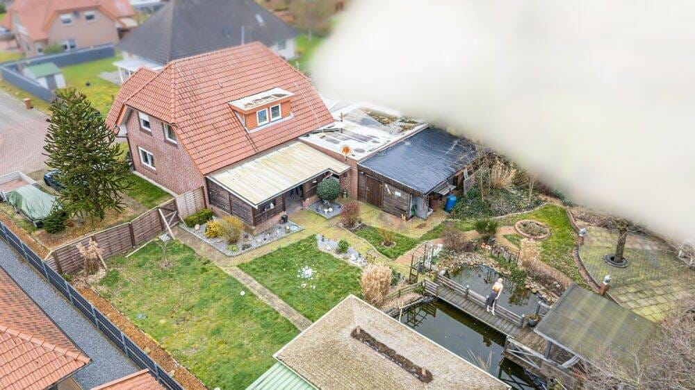Immobilie in Niederlangen - Vermietetes Einfamilienhaus mit Garage, Carport, überdachter Terrasse und großem Gartenhaus! - Bild 2