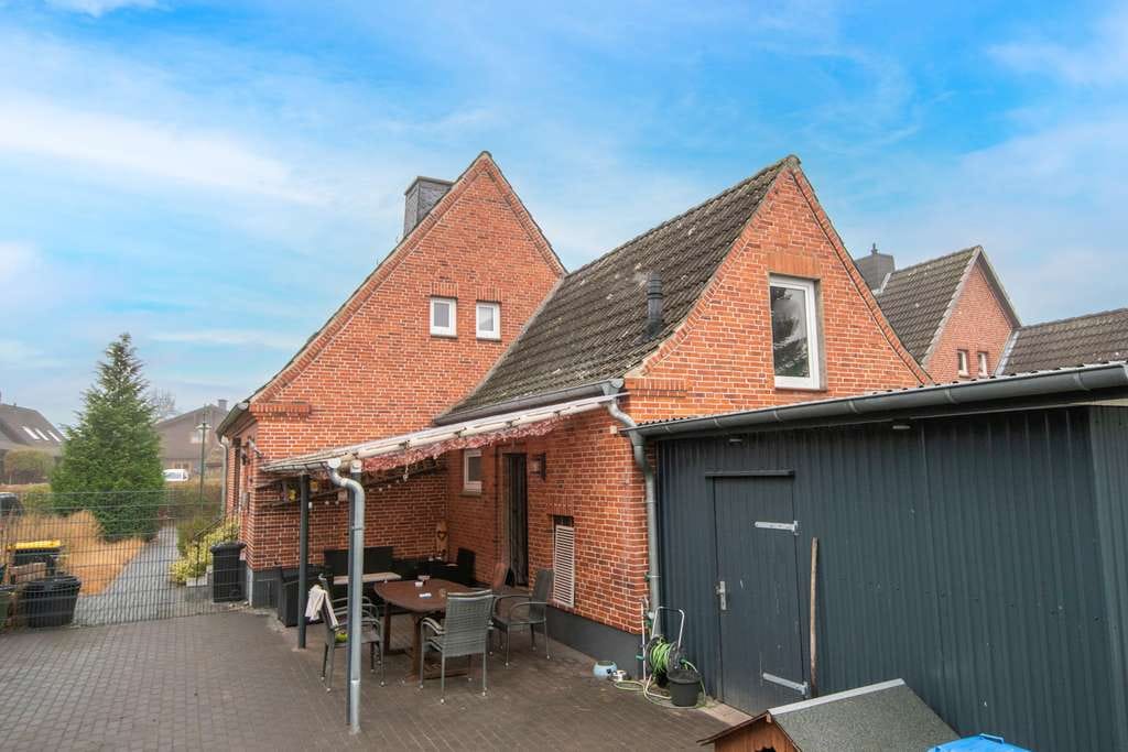 Immobilie in Moorrege - Gemütliches Zuhause mit Kamin und Garten in Moorrege - Bild 1