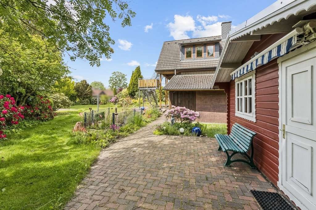 Immobilie in Soltau - Einfamilienhaus mit Einliegerwohnung und traumhaftem Garten - Bild 3