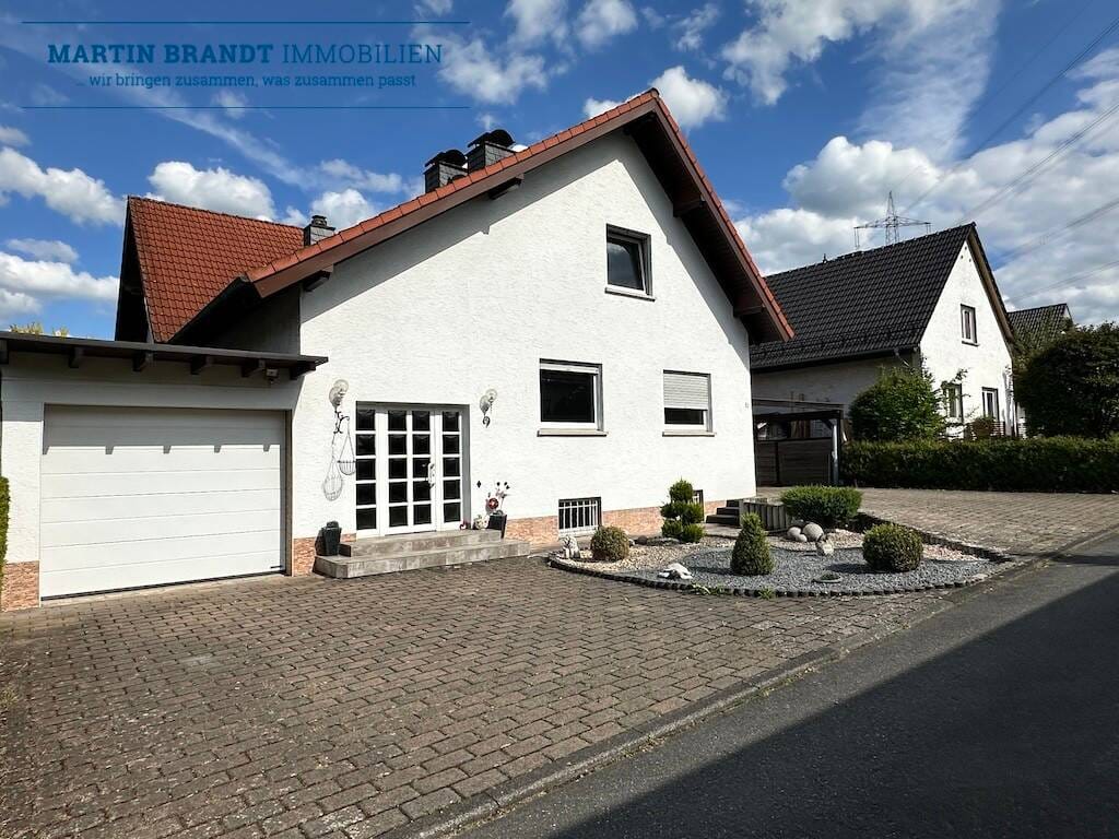 Immobilie in Hünstetten - Attraktives 2 Familienhaus mit großen Garten in schöner Wohnlage von Idstein-Wörsdorf - Bild 1
