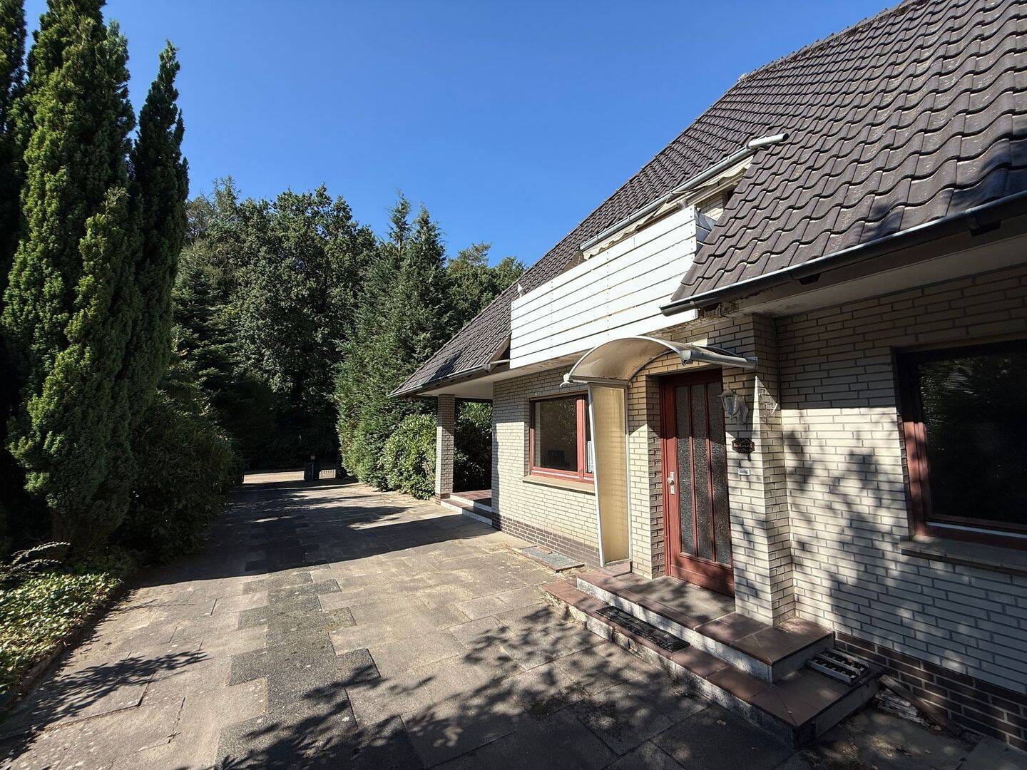 Immobilie in Stuhr - Attraktives Ein- bis Zweifamilienhaus mit Garage in idyllischer Lage von Stuhr-Fahrenhorst - Bild 2