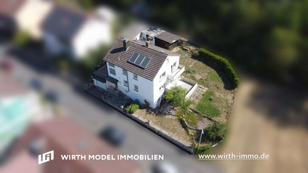 Immobilie in Poppenhausen - Einfamilienhaus mit Garage und Garten in schöner Ortsrandlage in Poppenhausen-Hain - Bild 0