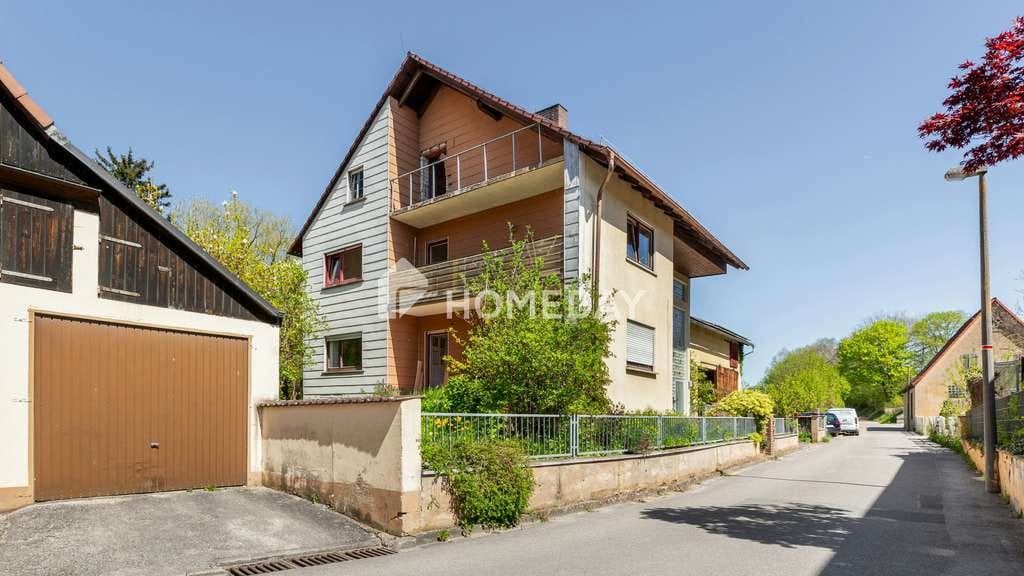Immobilie in Kammerstein - Einfamilienhaus mit 2 Wohneinheiten und weiterem Ausbaupotenzial mit Naturgarten und Nebengelass - Bild 1