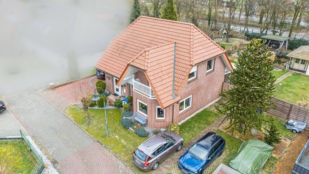 Immobilie in Niederlangen - Vermietetes Einfamilienhaus mit Garage, Carport, überdachter Terrasse und großem Gartenhaus! - Bild 1