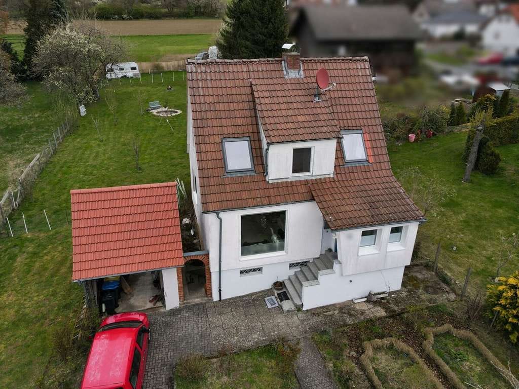 Immobilie in Schlüchtern - Modernisiert & Wohlfühlcharakter: Einfamilienhaus mit großem Garten in Schlüchtern-Hutten - Bild 1