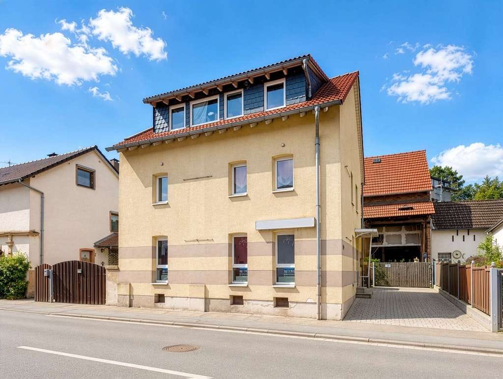 Immobilie in Brechen - Einfamilienhaus mit Friseursalon in Oberbrechen - Bild 1