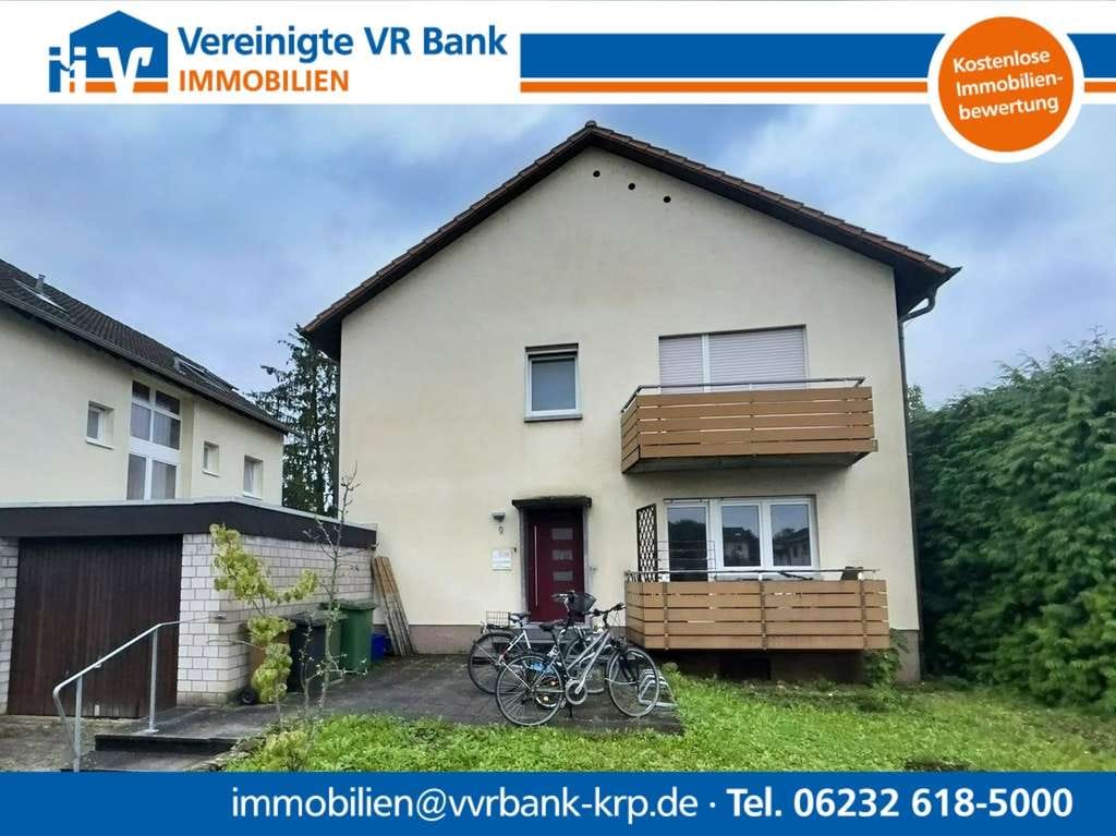 Immobilie in Oftersheim - Vermietetes Zweifamilienhaus mit großem Garten - Bild 0