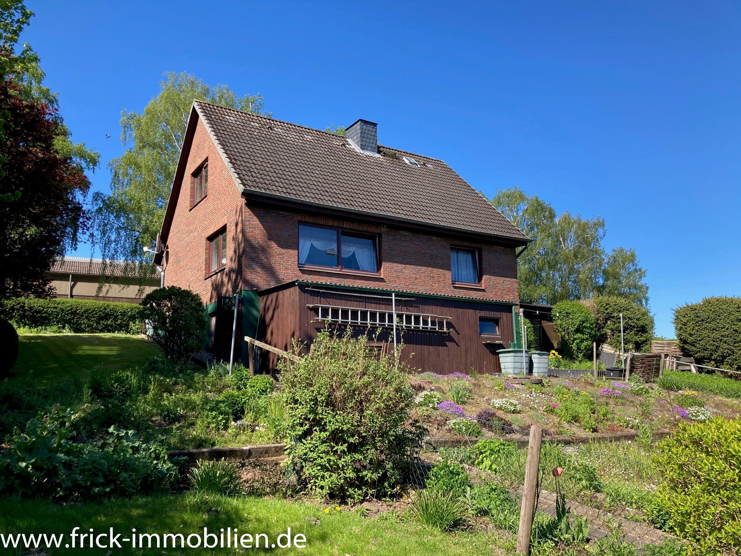 Immobilie in Malente - Einfamilienhaus in Feldrandlage mit kilometerweitem Fernblick - Bild 1