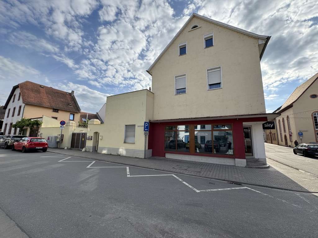 Immobilie in Osthofen - Attraktives Mehrfamilienhaus mit Ladengeschäft und Entwicklungspotenzial in begehrter Lage - Bild 1