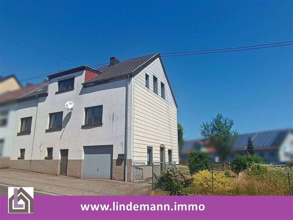 Immobilie in Merchweiler - Einseitig angebautes Einfamilienhaus mit schönem Grundstück - Bild 0