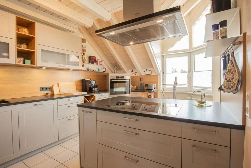 Immobilie in Heuweiler - Stilvolle Maisonette-Wohnung mit Galerie und offenem Wohnkonzept - Bild 2
