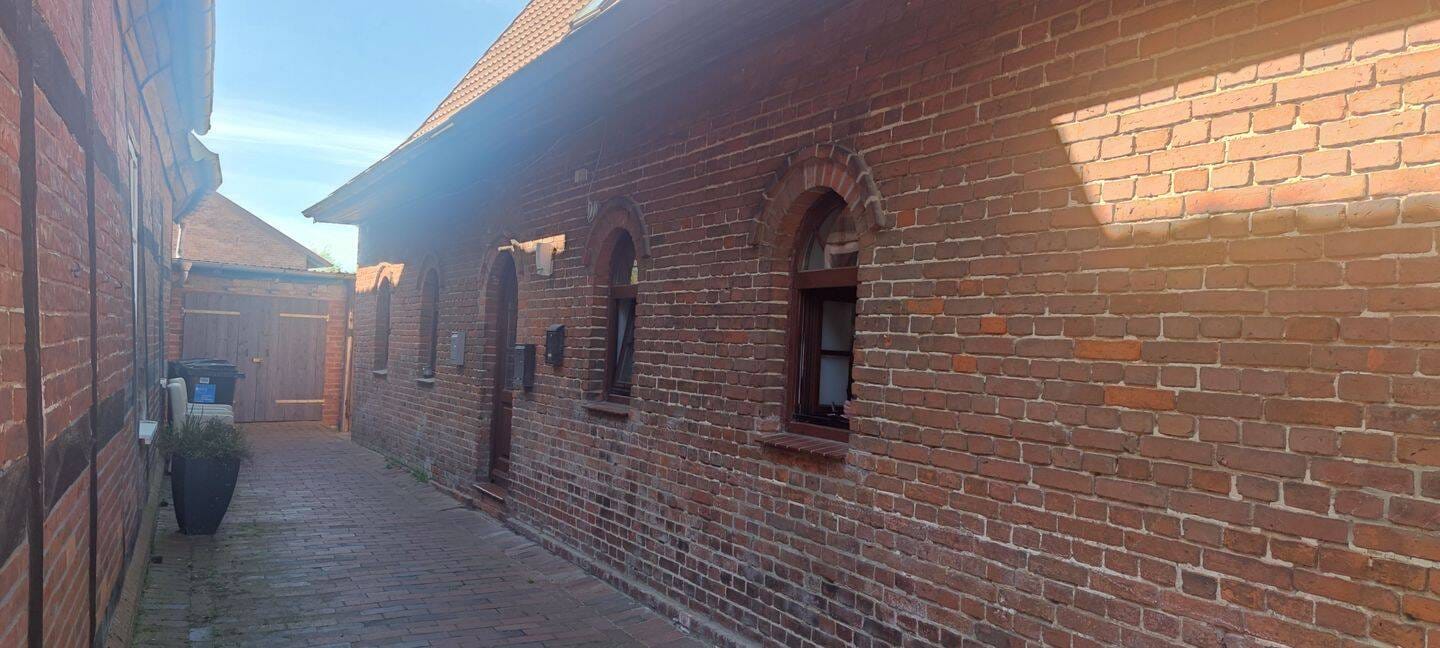 Immobilie in Bücken - Anlageobjekt mit 9 WE innerhalb eines 3-teiligen Gebäudekomplexes im Kernbereich von Bücken zu verkaufen! - Bild 2