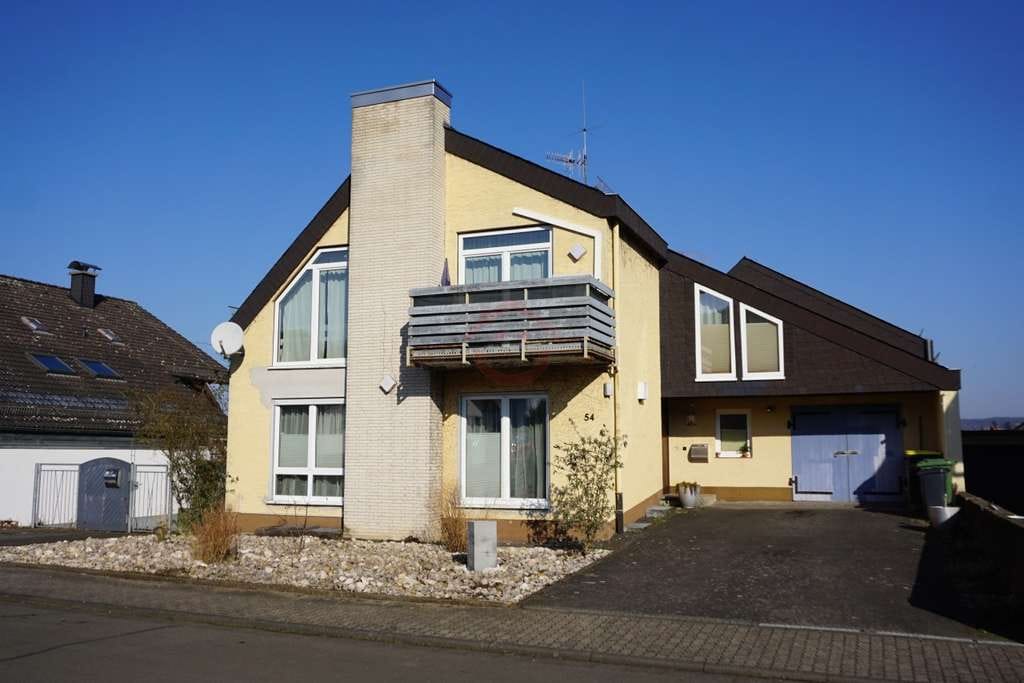 Immobilie in Buseck - Reduzierter Preis: Wohnhaus nach Architektenentwurf - Selber wohnen und vermieten zugleich! - Bild 1