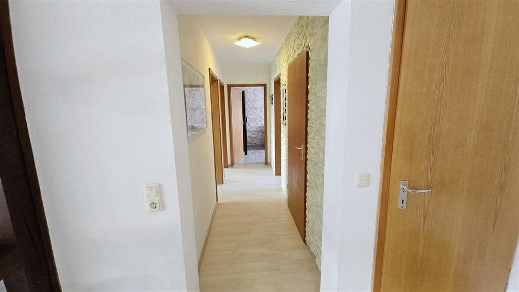 Immobilie in Poppenhausen - Großzügiges Reihenendhaus mit Einliegerwohnung, Garten und Garage in ruhiger Lage von Kützberg - Bild 1